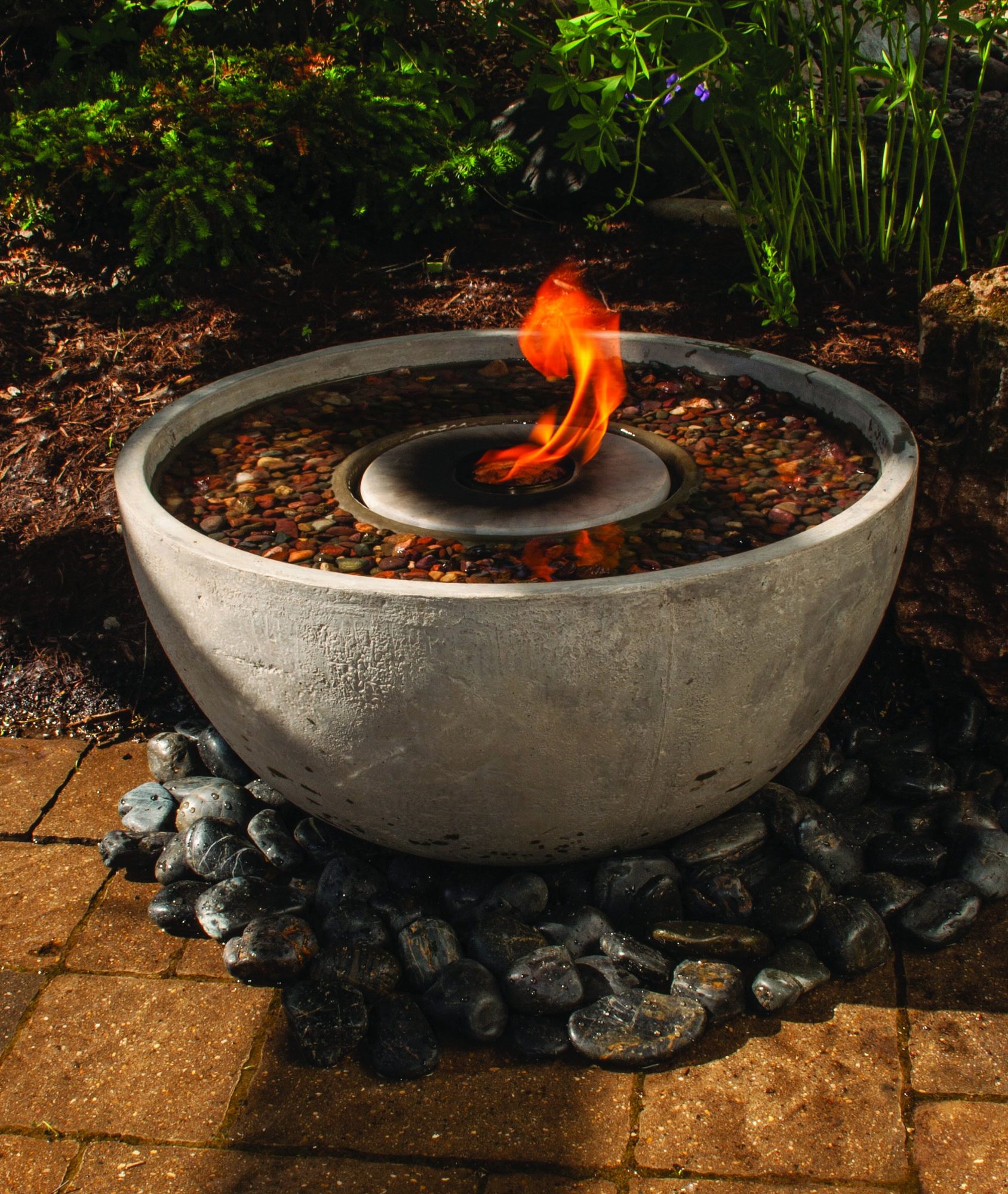 Fire bowl on the patio, built by iPond and Landscapes