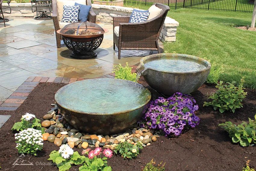 Spillway bowls in the garden, built by iPond and Landscapes