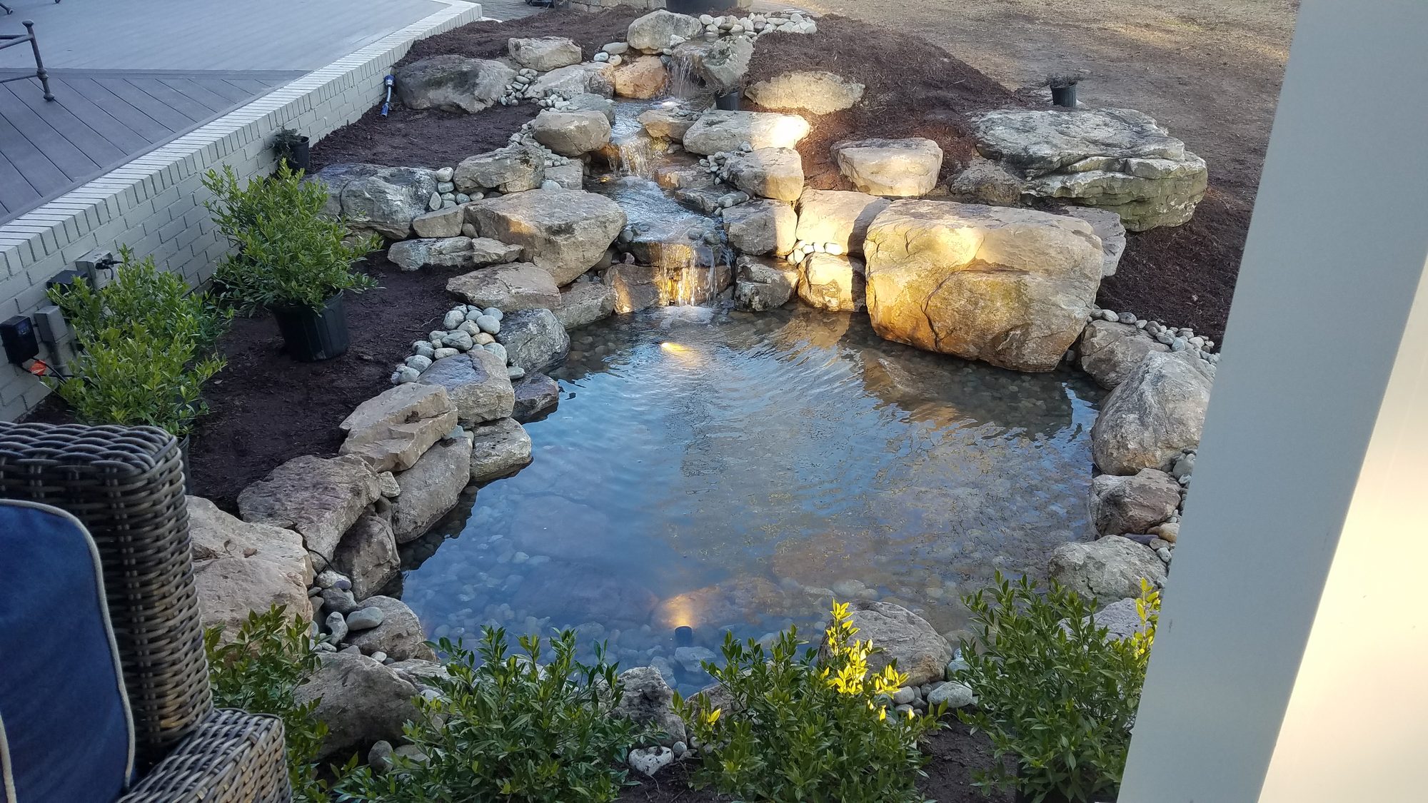 Koi pond with lighting, New Bern, built by iPond and Landscapes