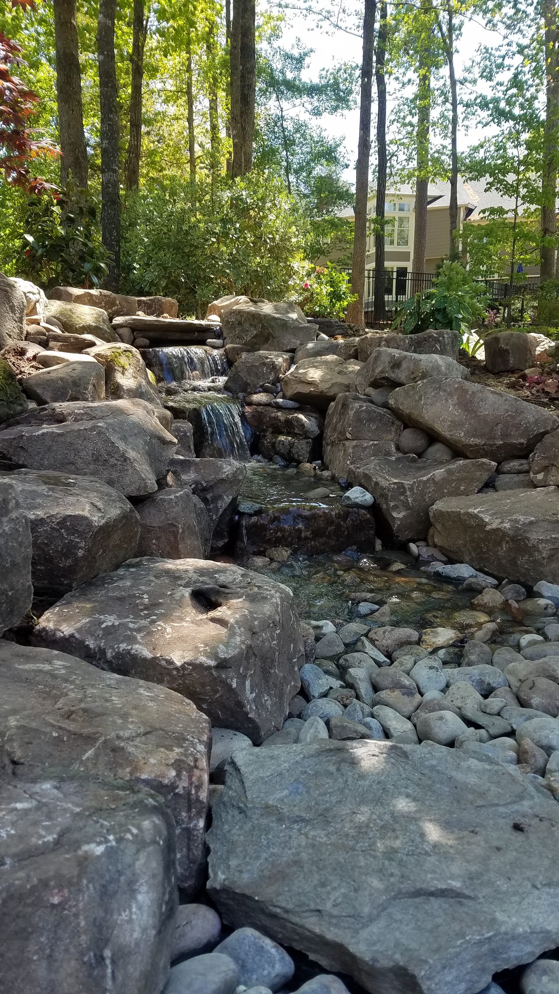 Pondless waterfall in the woods, Apex, built by iPond and Landscapes