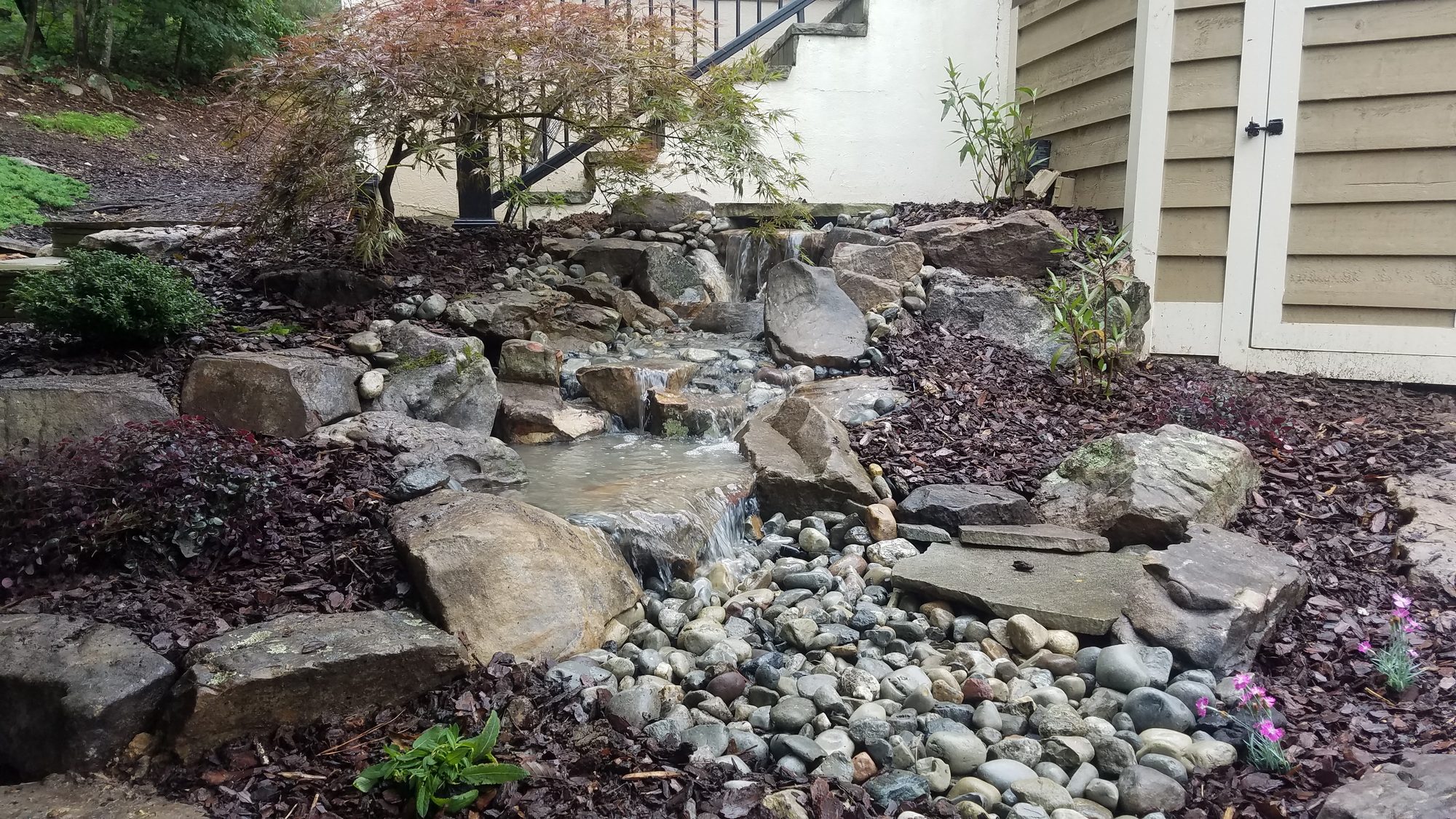 Pondless waterfall, Governors Club, Chapel Hill, built by iPond and Landscapes